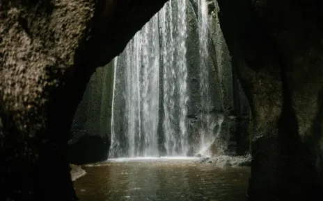 Waterfall flowing in rocky ravine